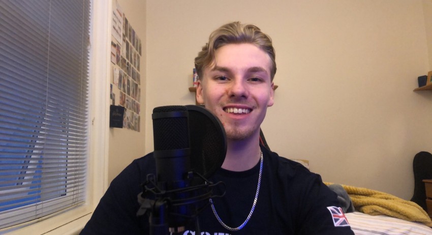 Alex at the podcast deck in his Scotty's shirt