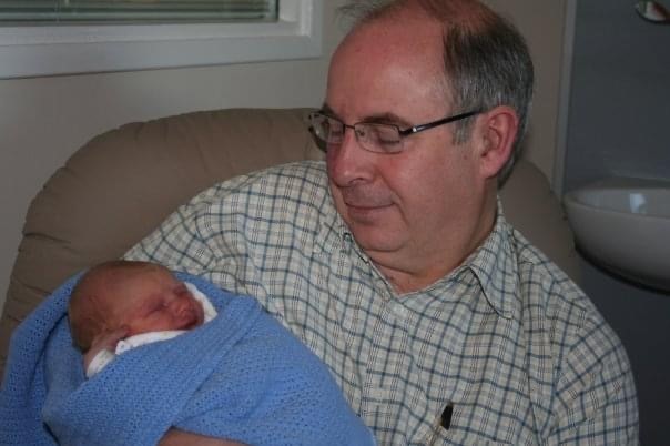 Baby Sebastian and his dad, Reverend John Hill MBE