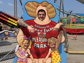 Gavin and his children having fun at Barry Island Pleasure Park in Wales