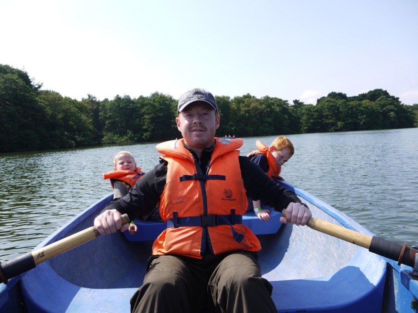 Ian on a rowing boat with Cambell and Austin