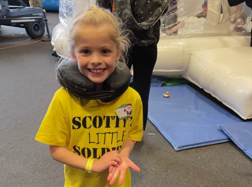 Isla wearing her Scotty's top with pride