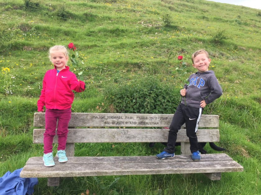 Charlie and Isla standing on Michael's bench