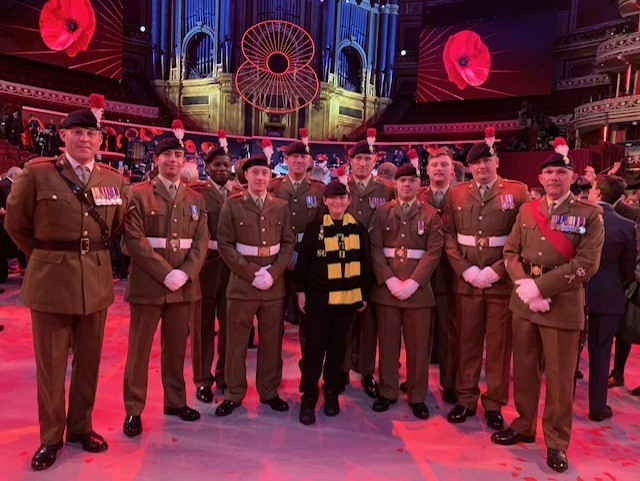 Jack pictured in a beret with a group of Fusiliers at BBC One's Festival of Remembrance
