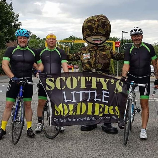 Tour de Scotty challengers posing with our mascot