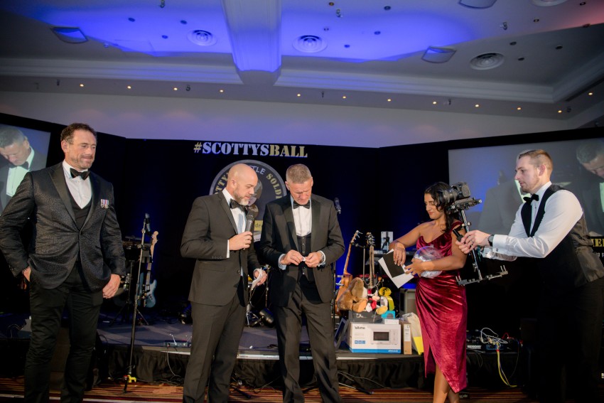 Digital marketing expert Lucy presenting prizes at Scotty's 2022 Ball with Billy Billingham and Jason Fox