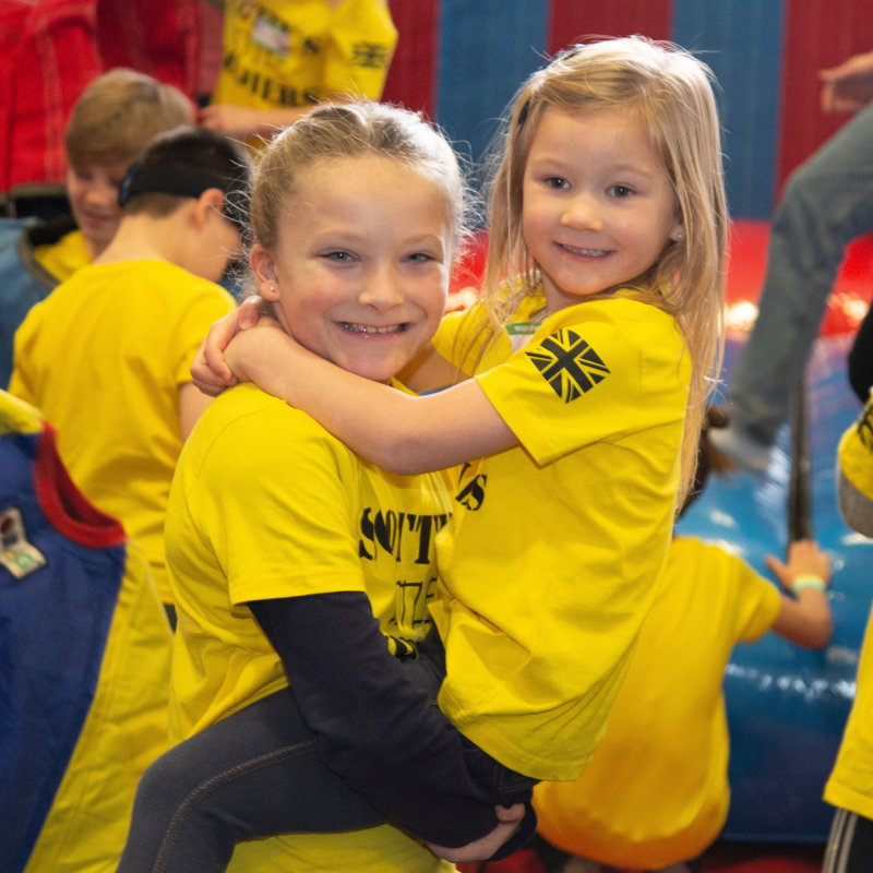 Bereaved military children at Scotty's Little Soldiers Christmas Party in yellow t-shirts
